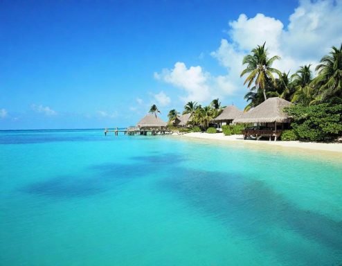 Caribbean beach destination wedding and honeymoon at an all-inclusive resort with overwater bungalows