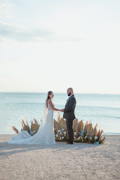 Bride and groom at a Caribbean beach destination wedding and honeymoon at an all-inclusive resort